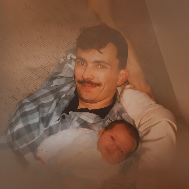 Saving Dad — Conor's dad holding him as a newborn